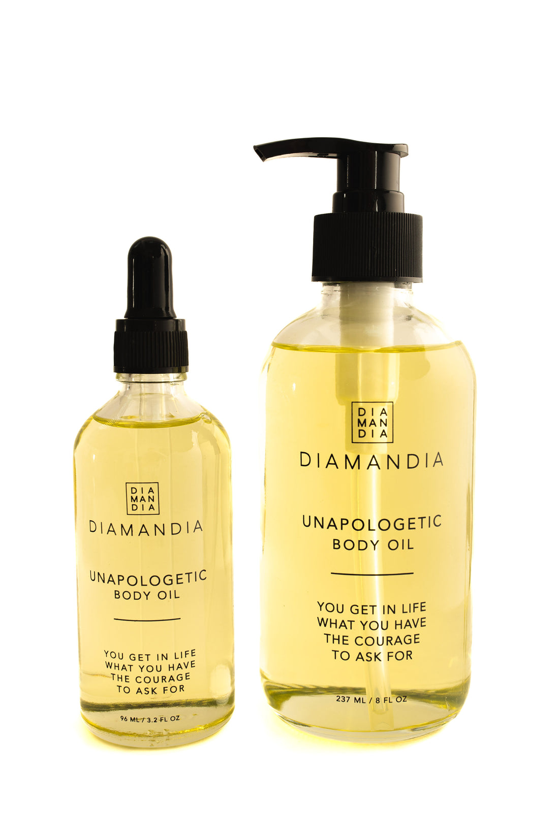 Unapologetic Body Oil in two sizes against white background. 